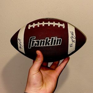 This is a signed ball by 2 NFL Players